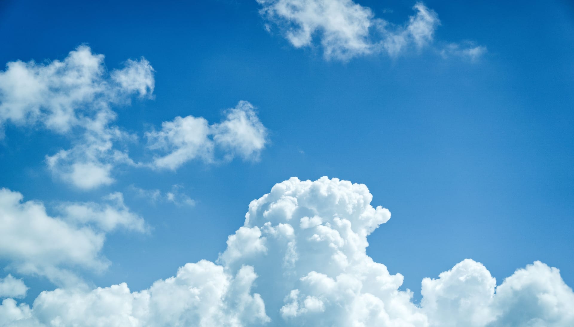 Perfect blue sky with scattered cumulus — conditions at every dropzone, apparently